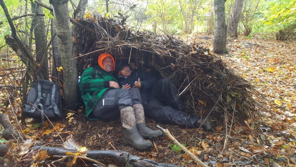 Kris showing us that two people can fit in his shelter. Photo credit: Angela Snowman